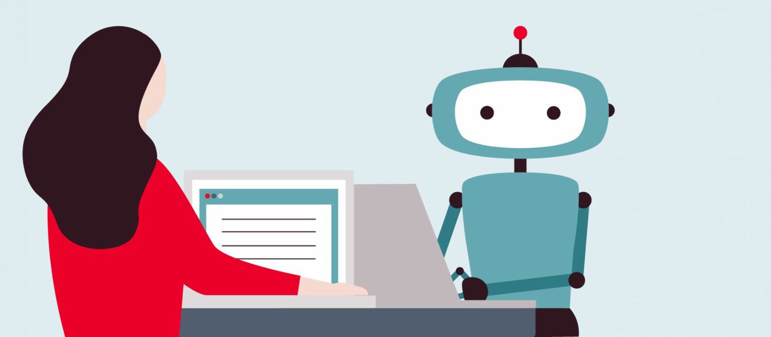 Billede af en kvinde foran en computer, der ser på en robot