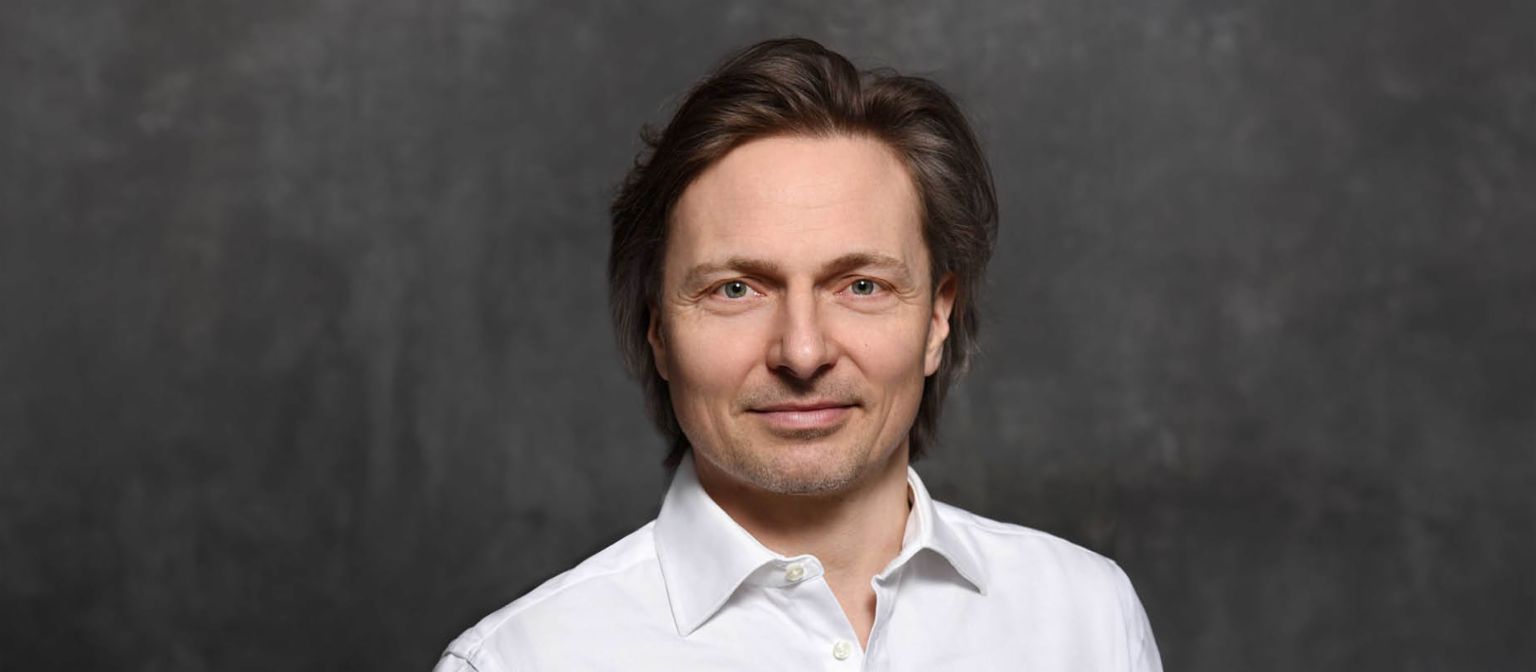 Cybersecurity expert Janusch Skubatz, Chief Information Security Officer of the EOS Group, with brown hair and white shirt